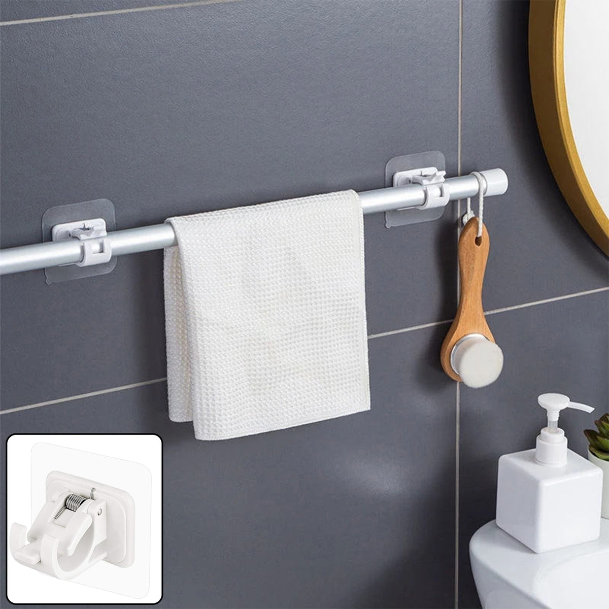 No-drill adhesive rod holders holding a towel rod in a bathroom