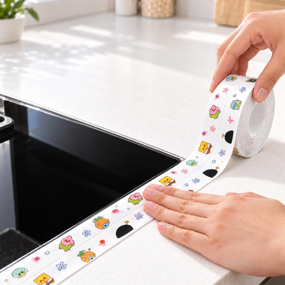 Applying waterproof sealing tape along the kitchen sink edge