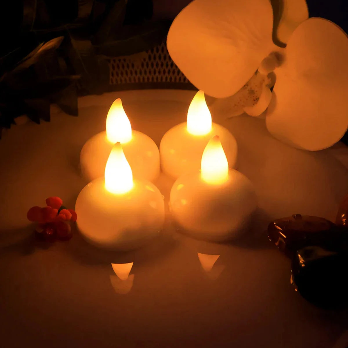 Close-up of flickering LED tealight glow
