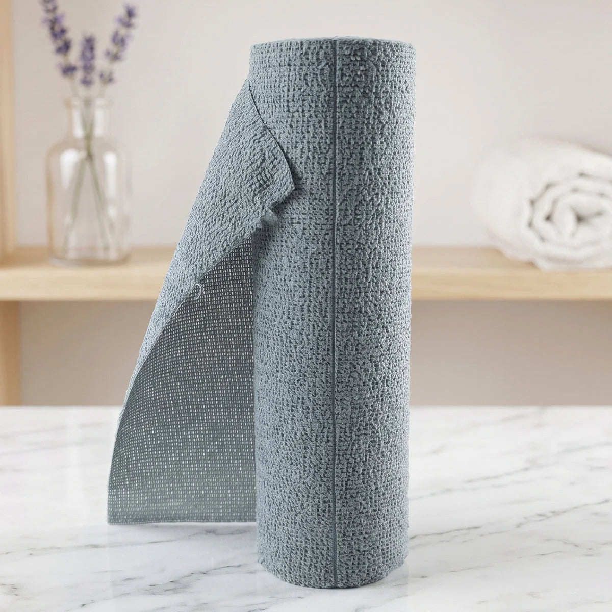 Tearing a cloth from the microfiber kitchen towel roll