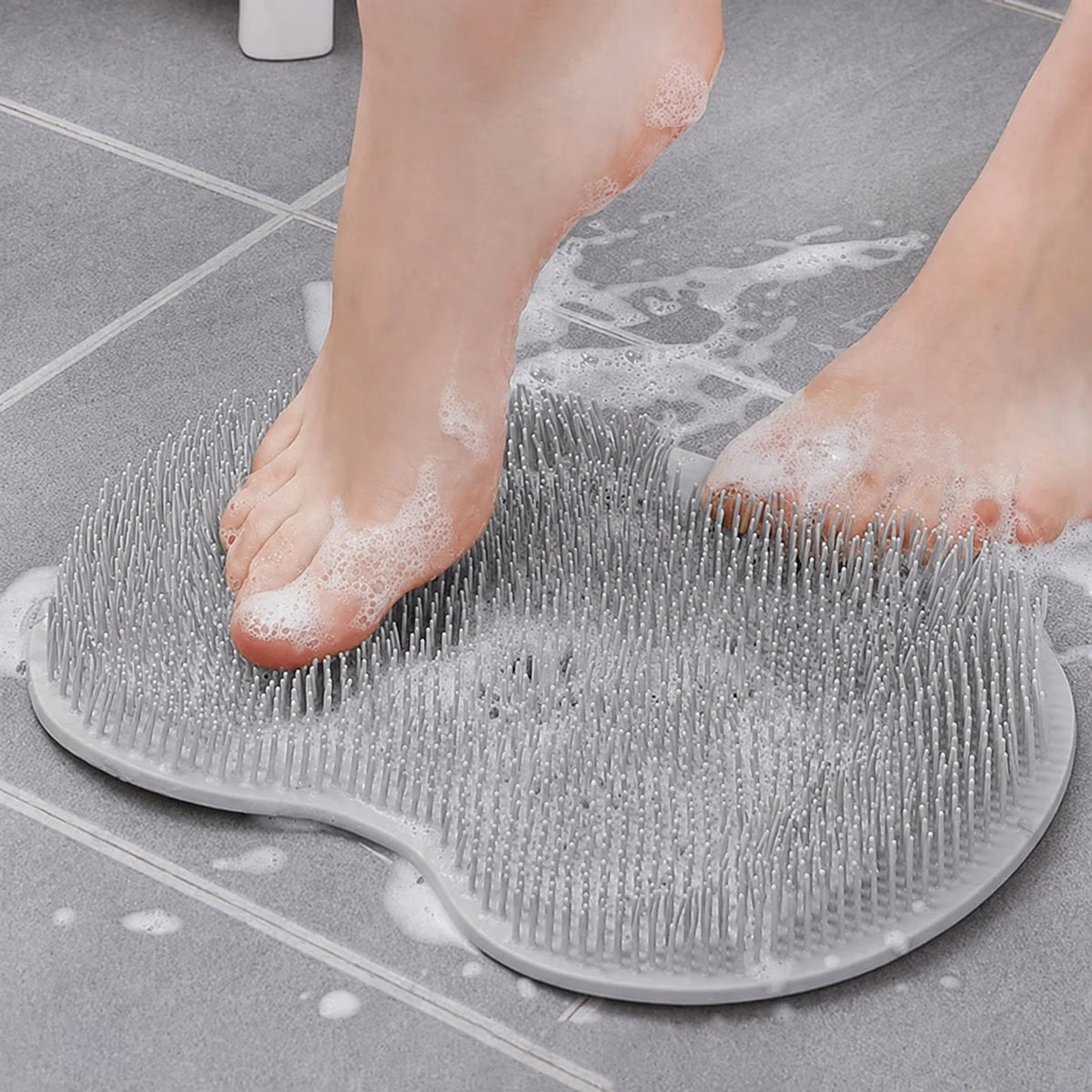 Feet on silicone foot scrubber mat in shower